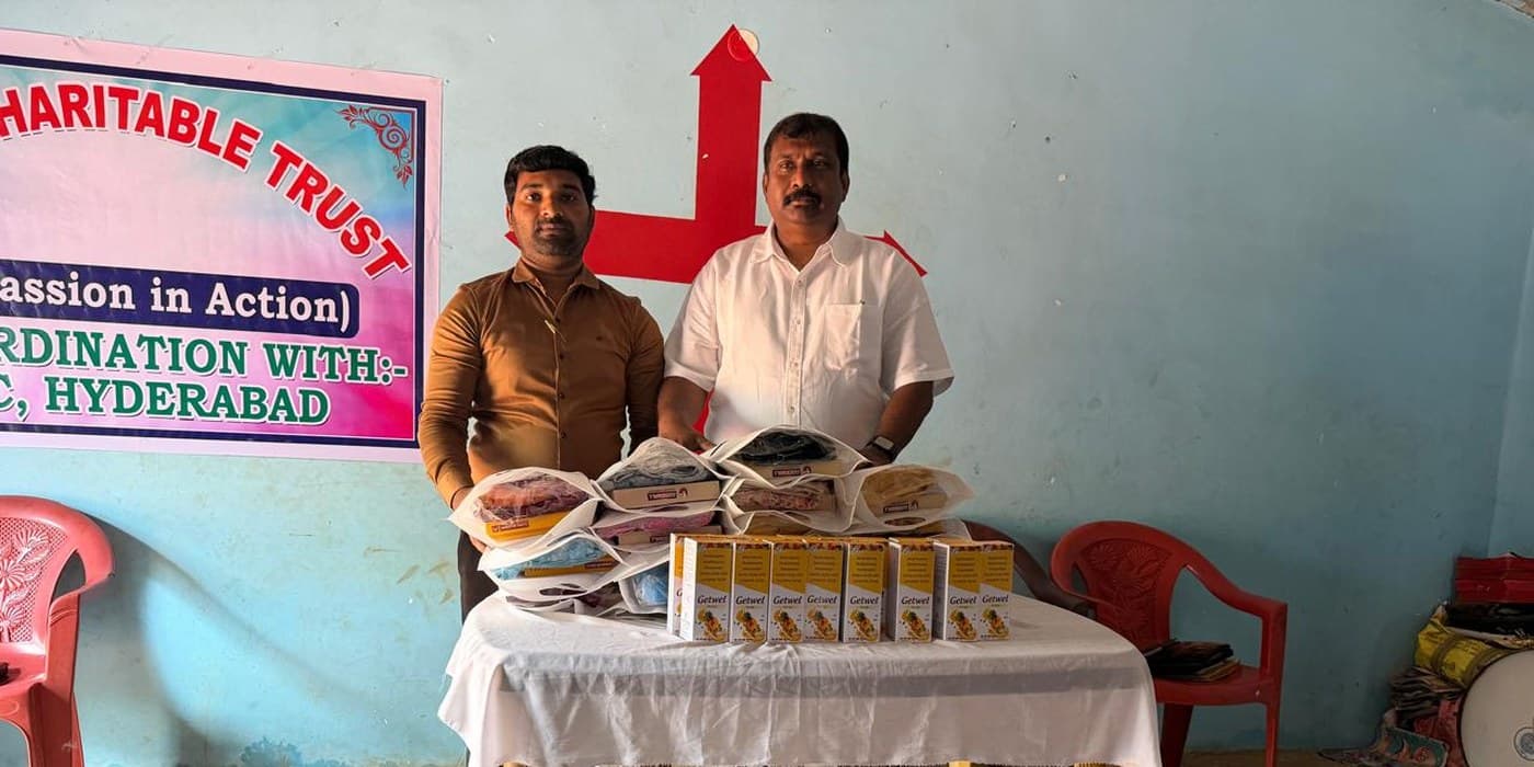 MERCE Charitable Trust leaders at a community outreach event with the organisation banner visible