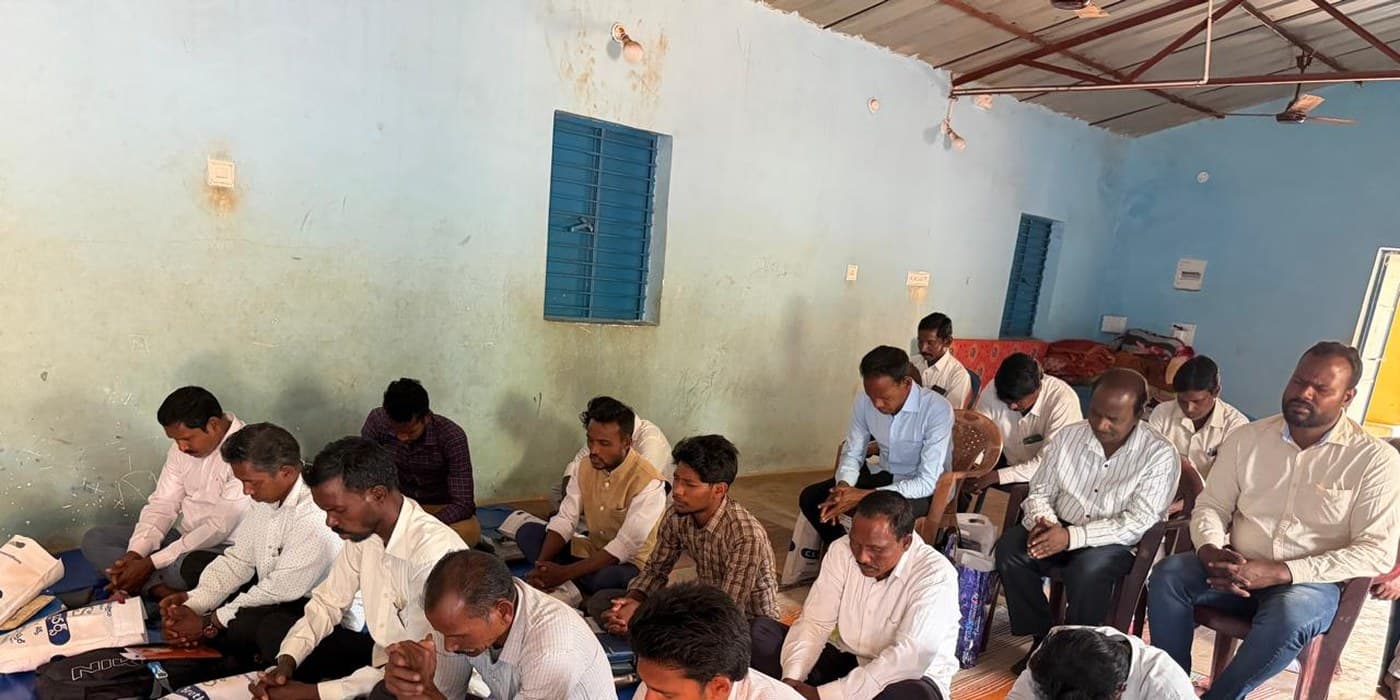 MCT team and community members gathered in prayer