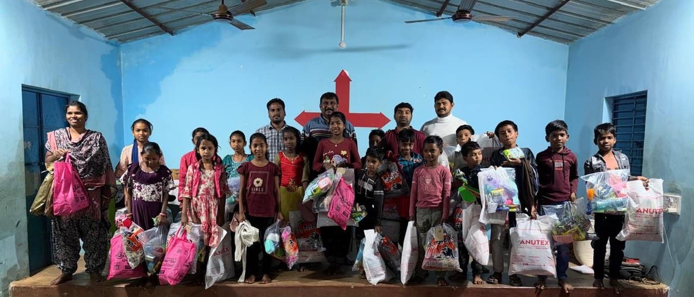 MERCE Charitable Trust team and community members gathered after a successful distribution event at a village church