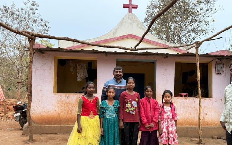 Girls from a tribal village community with MCT leader outside a village church